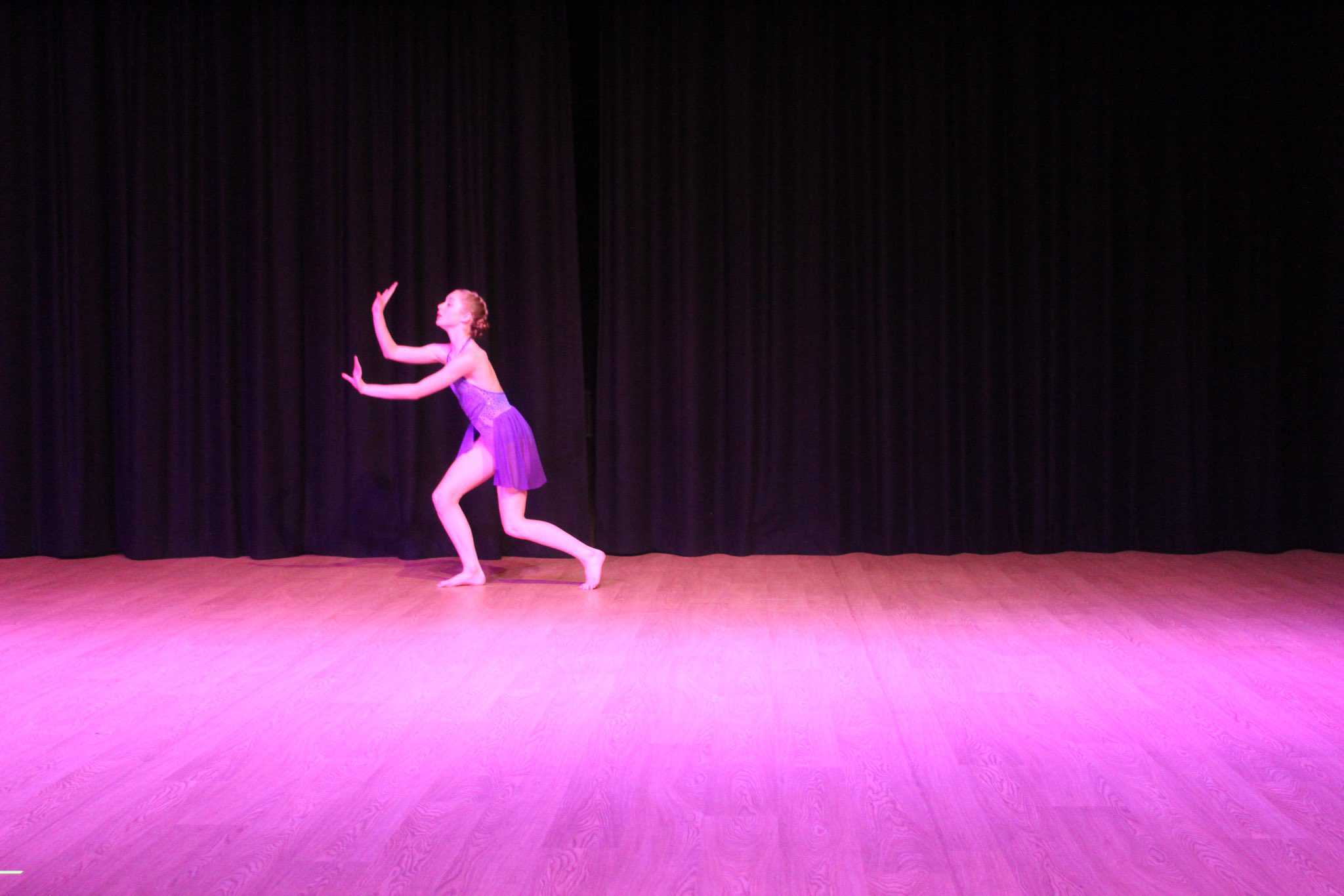 A student performs in Didsbury High School Free to Fly Dance Showcase 2023.