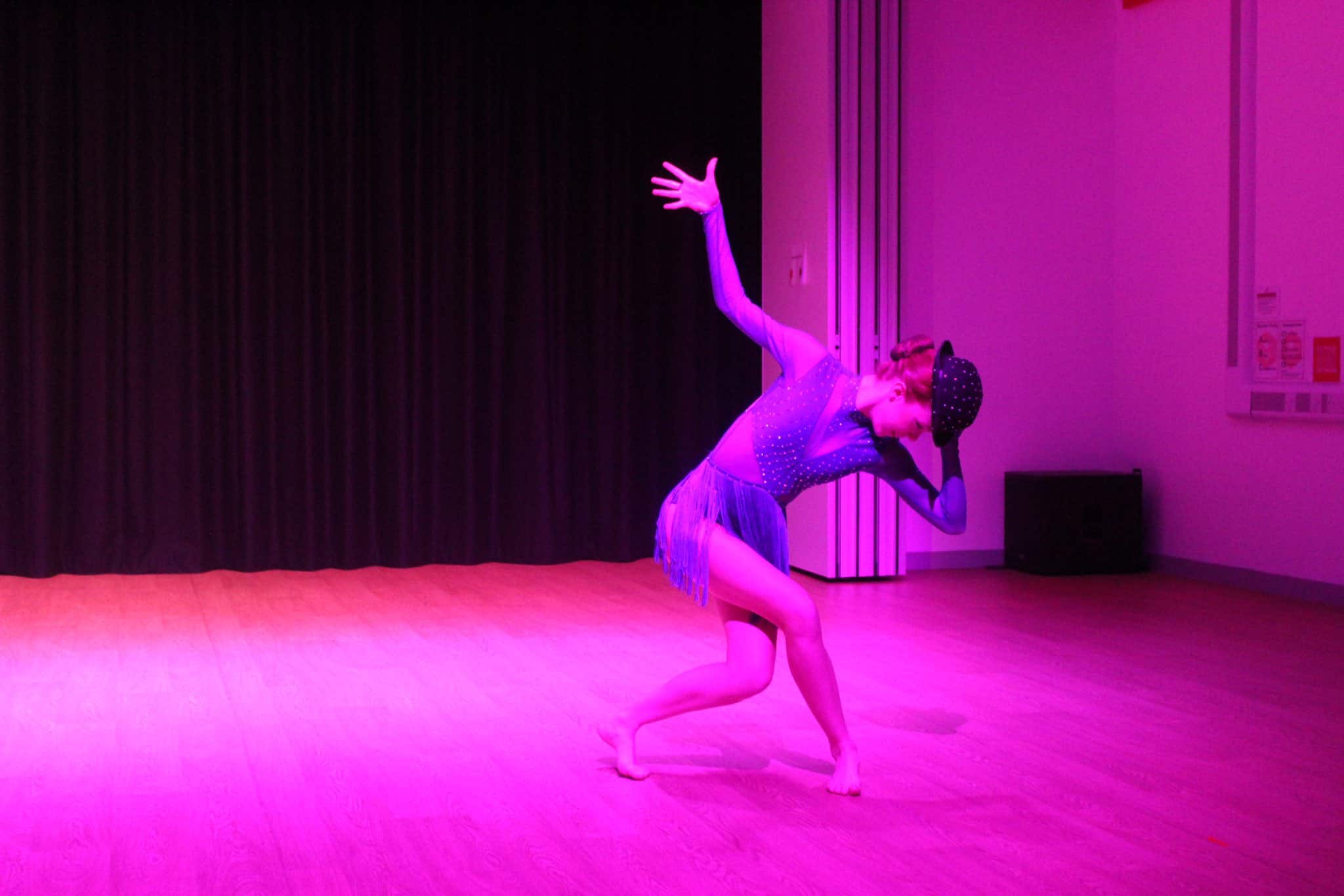 A student performs in Didsbury High School Free to Fly Dance Showcase 2023.