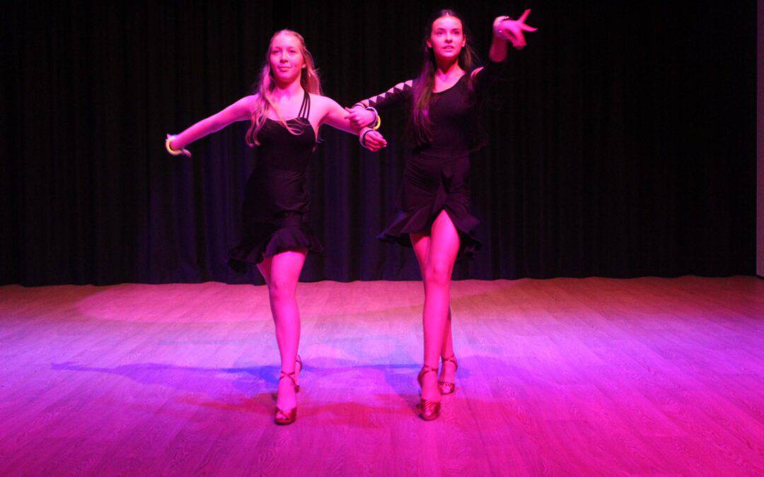 Two students perform together in Didsbury High School Free to Fly Dance Showcase 2023.
