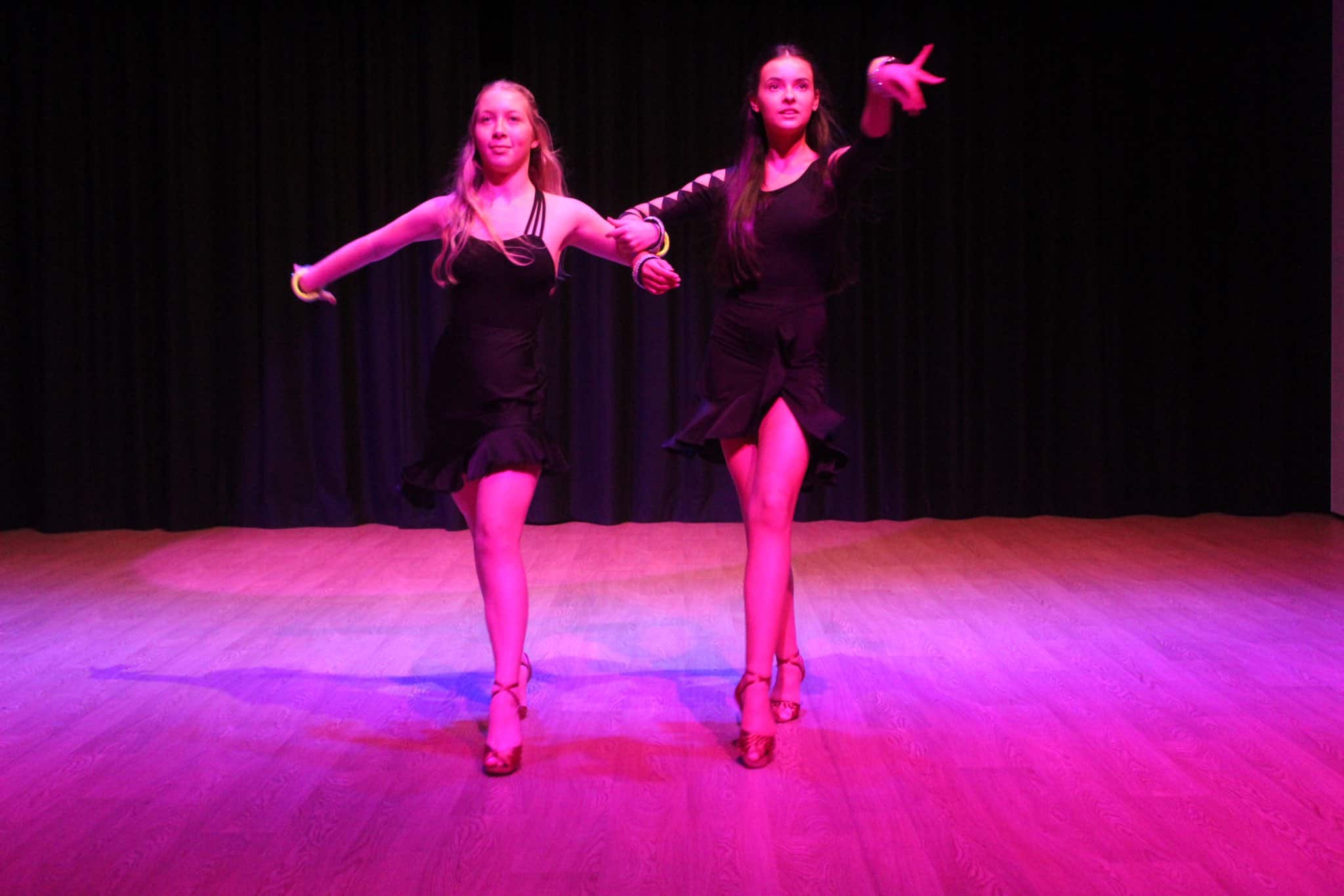 Two students perform together in Didsbury High School Free to Fly Dance Showcase 2023.