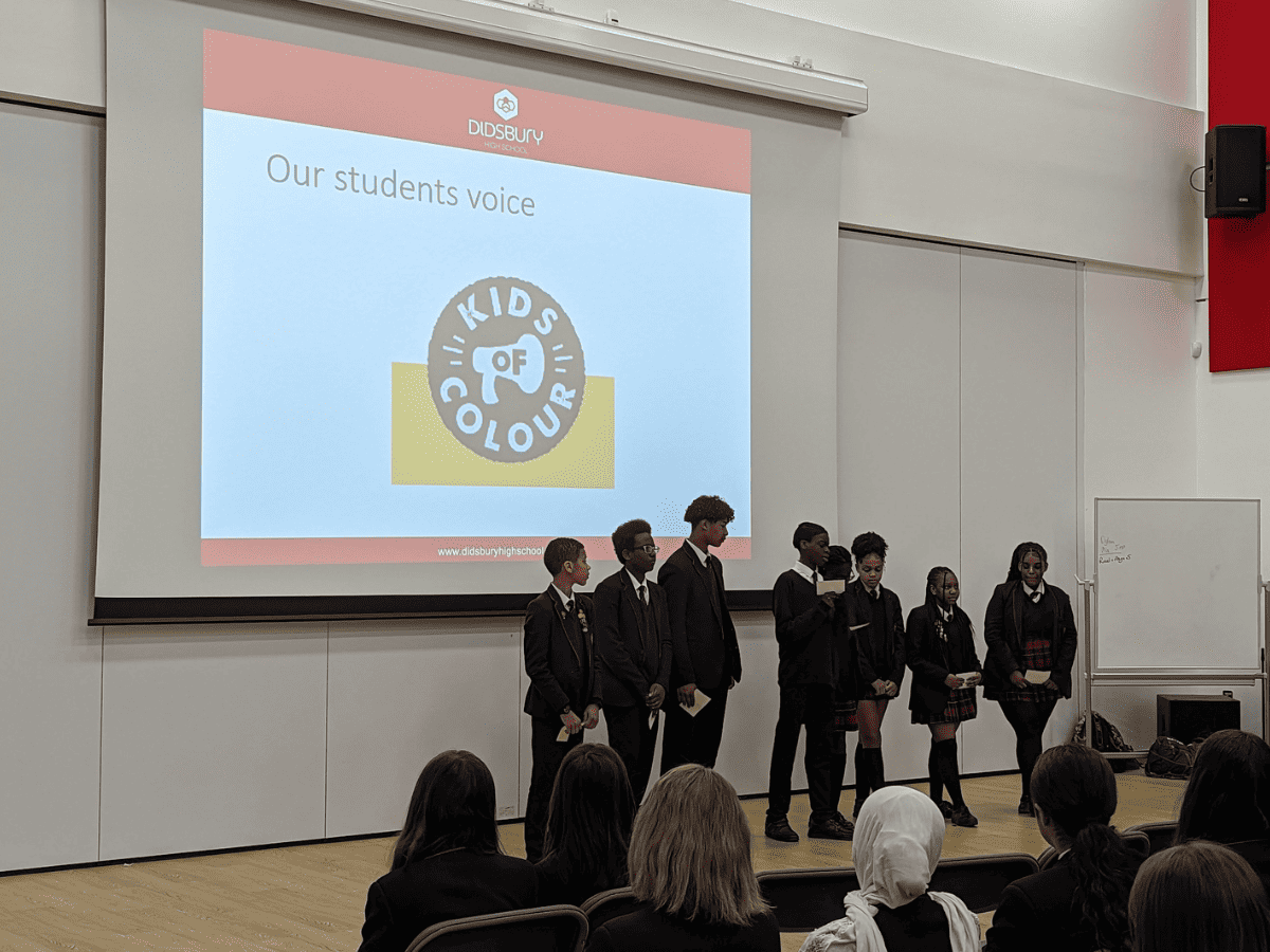 A group of Year 9 Didsbury High School students hold an assembly about the work they did with Kids of Colour