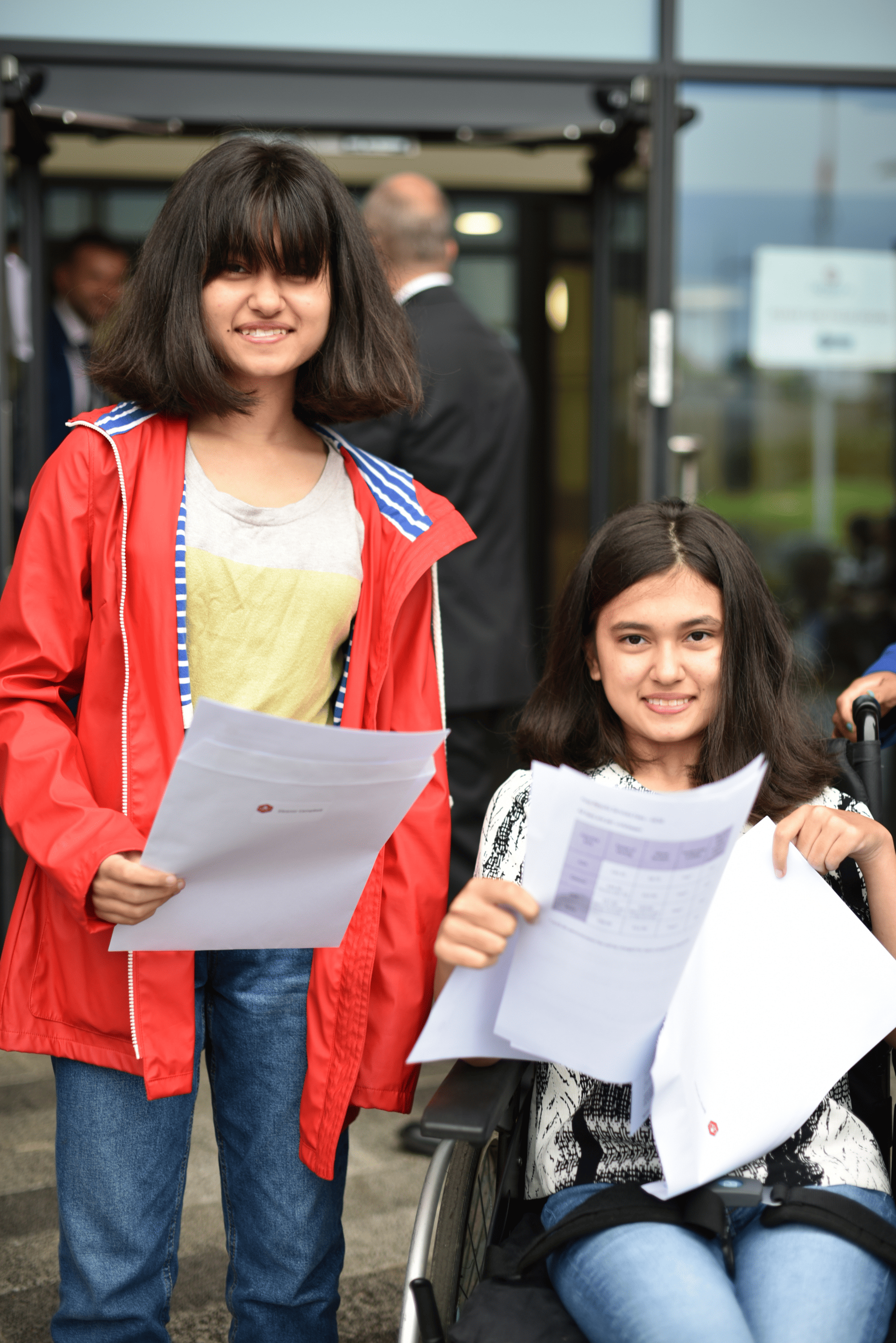 Two Didsbury High School students open their GCSE results.