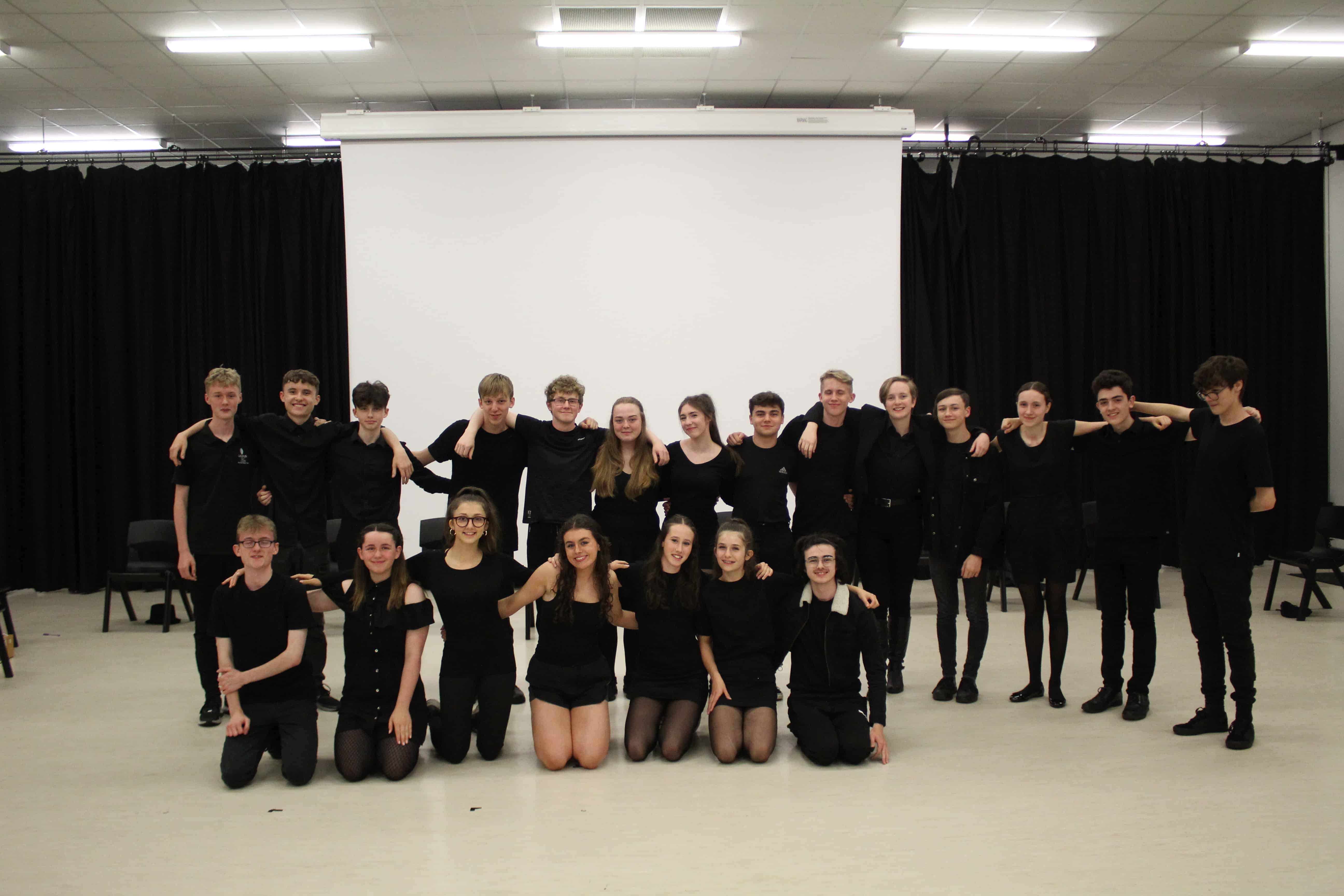 The students from Didsbury High School and other Laurus Trust secondaries who are part of Laurus Limelights smile together in a group photo.