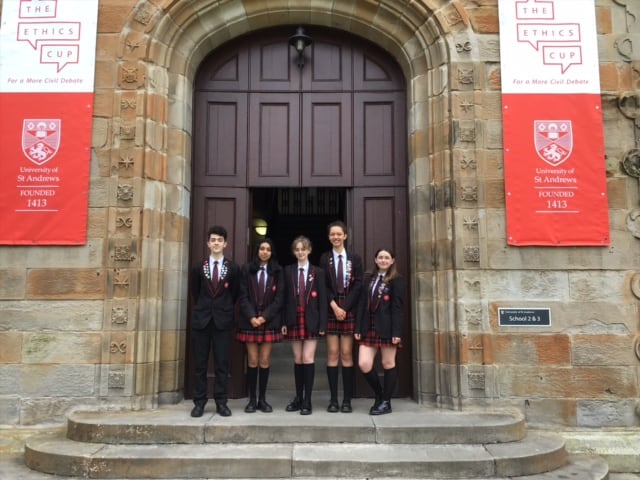 The Didsbury High School students who competed in the Ethics Cup final stand outside of the doors at the University of St Andrews