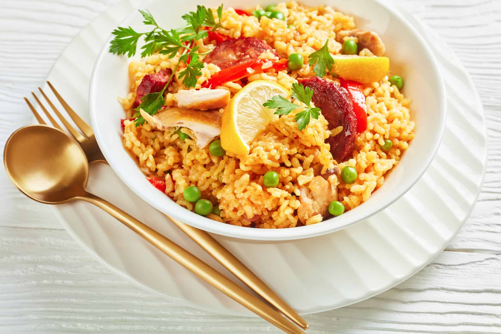 spanish chicken paella on a white plate