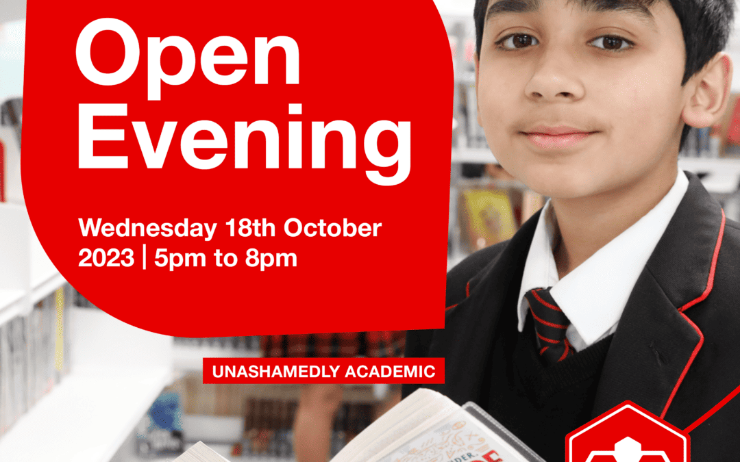 Didsbury High School student smiling whilst reading a book