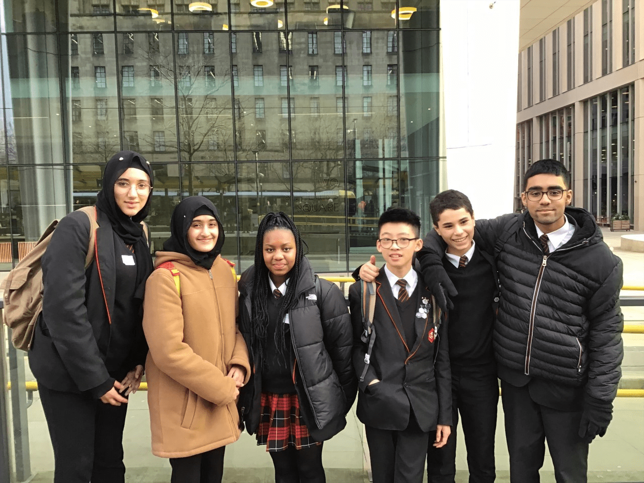 A group of Year 9 students smile in front of the People's History Museum